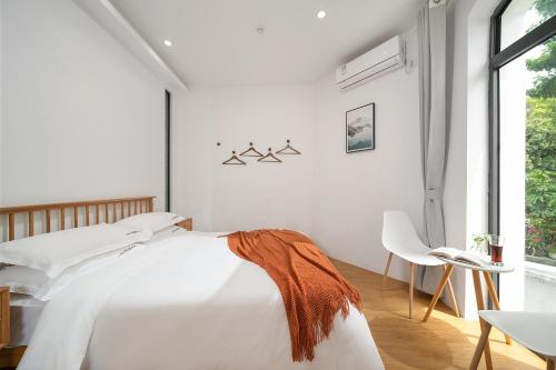 Gulangyu Sunlit Rock Garden Resortにあるベッド