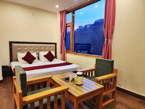 Katil atau katil-katil dalam bilik di Royal cedar Retreat