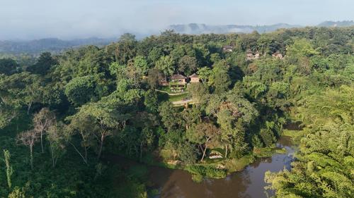 an aerial view of a house in the middle of a river at Chivit Thamma Da Mountain Home in Mae Chan