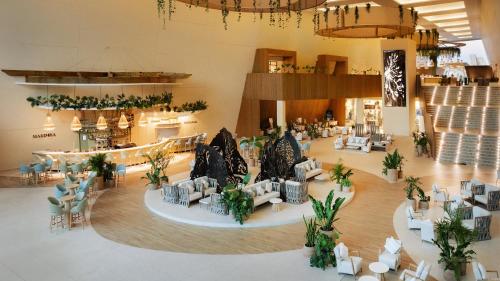 an overhead view of a lobby with couches and plants at Grand Sirenis Riviera Maya Resort & Spa All Inclusive in Akumal