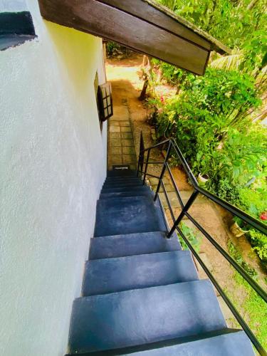 a set of stairs leading up to a house at Talalla Wonder View in Talalla South