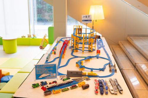 a toy track with a toy train set on a table at KKR Hotel Kanazawa in Kanazawa