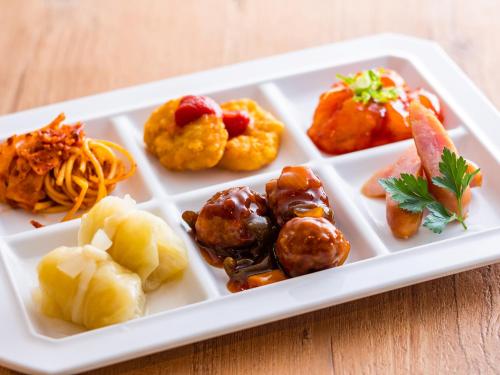 a white plate with different types of food on it at Asagiriso in Toyooka