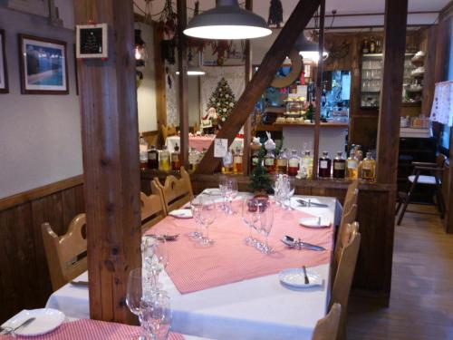 a table with wine glasses on it in a restaurant at North Point Lodge in Minami Uonuma