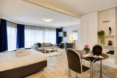 Postel nebo postele na pokoji v ubytování First Euroflat Hotel