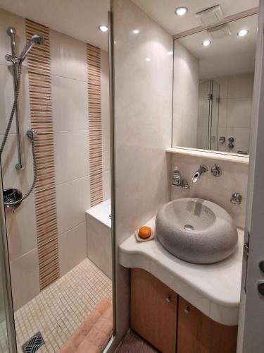 a bathroom with a sink and a shower at Ferienwohnung Alpenglück mit Schwimmbad und Sauna in Oberstdorf