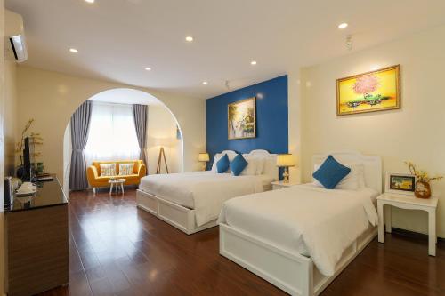 Postel nebo postele na pokoji v ubytování Chez Mimosa Corner