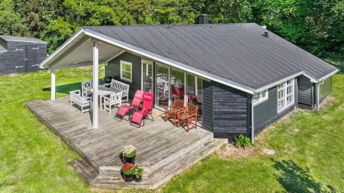 an overhead view of a tiny house with a deck at Summer House In Beautiful Nature In Brunshuse in Hårby