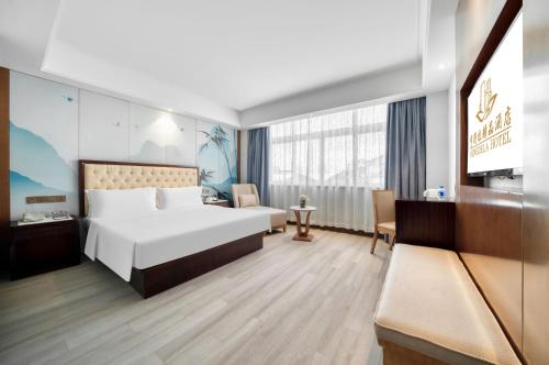 Cama o camas de una habitación en Hendra Hotel - Wenzhou Longwan International Airport Yongzhong Metro Station Branch