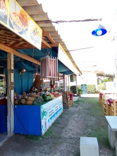 a fruit and vegetable stand at an outdoor market at DD Beach Houses in Phra Ae beach