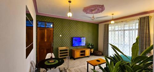 TV a/nebo společenská místnost v ubytování Kian Nest