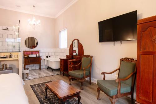 TV a/nebo společenská místnost v ubytování Murray Street 137 Guesthouse