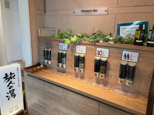 a display of bottles of wine on a wooden counter at Route Inn Grantia Ishigaki in Ishigaki Island