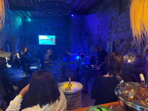 a group of people sitting in a room at The Old Mill Hotel Lapta in Kérynia