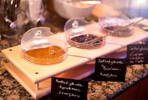 a buffet with two dishes of food on a counter at Hotel Heikenberg in Bad Lauterberg