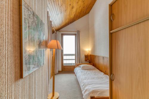 Postel nebo postele na pokoji v ubytování Souveraine 3 Charmant Appartement