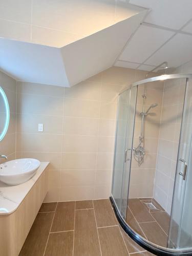 a bathroom with a shower and a sink at Summer Villa Sai Gon in Ho Chi Minh City