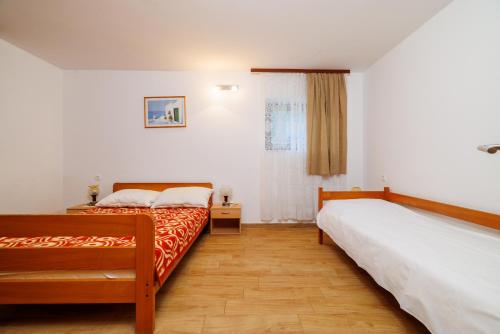 Postel nebo postele na pokoji v ubytování DRAGAN