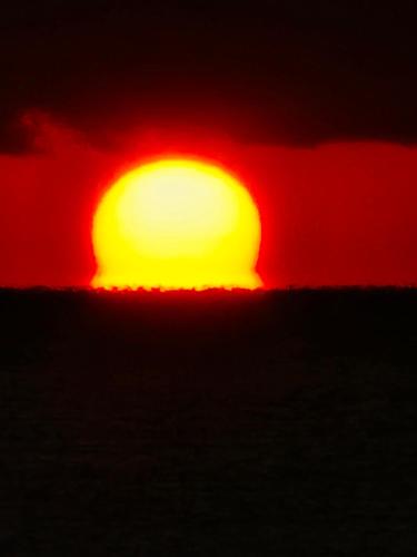 a sun setting over the horizon at Super Pilgrimage Inn Karyogo A Private Retreat Just for You in Nahari