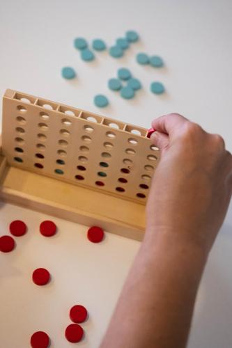 a person playing a board game with dots at U-Sense For You Hostel Sevilla in Seville