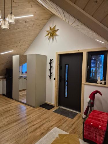 a living room with a star on the wall at Apartament z prywatna wanną hydromasaż - U Parów in Białka Tatrzanska