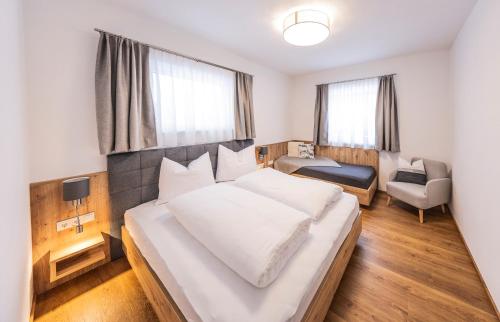Ένα ή περισσότερα κρεβάτια σε δωμάτιο στο Zeitlos Apartments Flachau