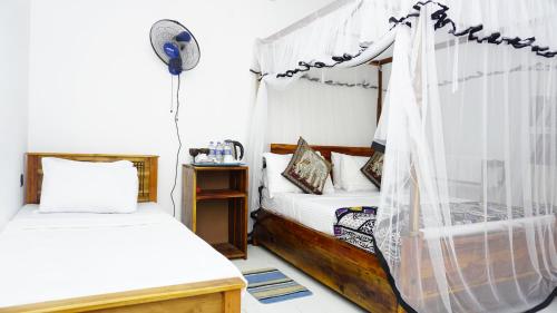 Postel nebo postele na pokoji v ubytování Namal Homestay Sigiriya