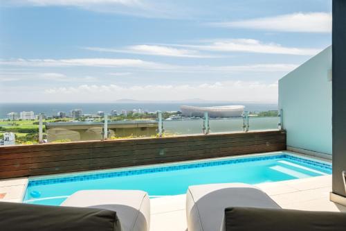 a swimming pool on the roof of a building at Villa Alexa in Cape Town