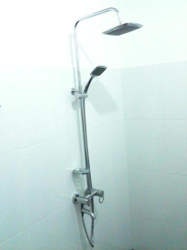 a shower in a bathroom with a shower head at Suwa Arana Resort in Mirissa