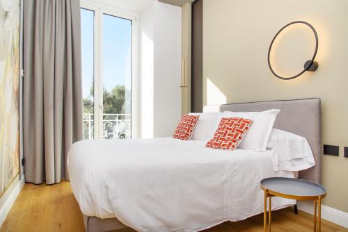 Postel nebo postele na pokoji v ubytování Vesuvius Palace Aparthotel