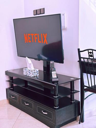 CHAY - Appartements a Ouarzazateにあるテレビまたはエンターテインメントセンター