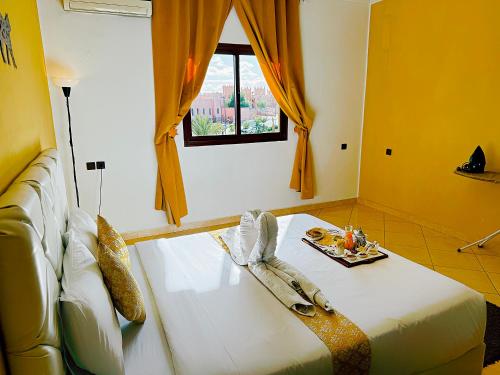 CHAY - Appartements a Ouarzazateにあるベッド