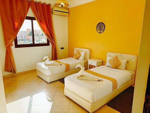 CHAY - Appartements a Ouarzazateにあるベッド