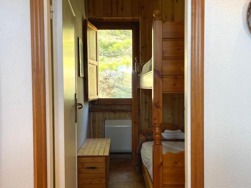 a small room with a bunk bed and a window at Casa Natura, Tradizione e Relax in Roccaraso