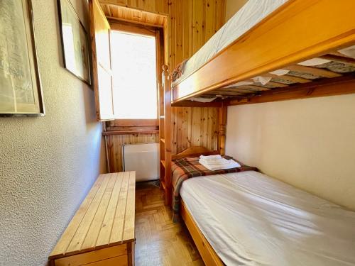 a bedroom with two bunk beds and a window at Casa Natura, Tradizione e Relax in Roccaraso