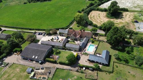 an aerial view of a house with a yard at Lower Dovehouse in Warrington