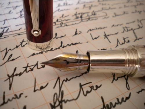 a fountain pen on top of a handwritten letter at Al Rivobello in Rivotorto 