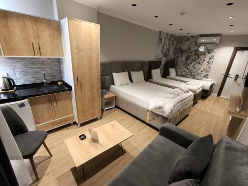 a living room with a bed and a couch at Edwin PLUS in Istanbul
