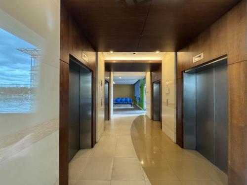 a hallway of a building with a view of the ocean at Beachfront U.S. Embassy Family Retreat. in Manila