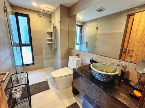 a bathroom with a sink and a toilet at Cozy Paradise By Rawai Beach in Phuket