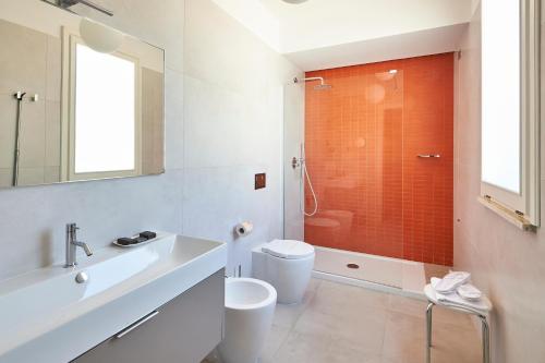 a bathroom with a sink and a toilet and a shower at Grand Hotel Riviera - CDSHotels in Santa Maria al Bagno