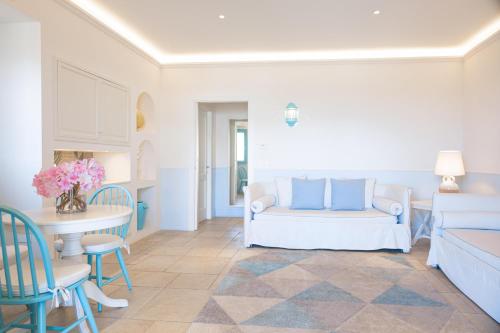 a living room with a couch and a table at Marenea Suite Hotel - CDSHotels in Marittima