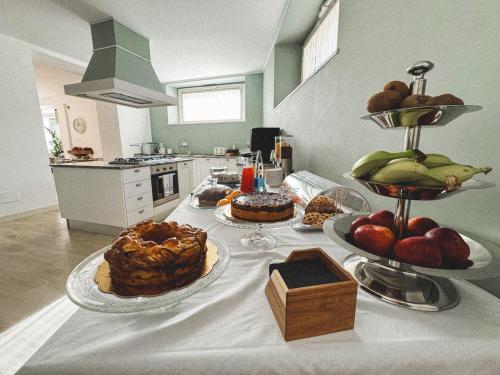 a table with several plates of food on it at Villacolle Visso in Visso