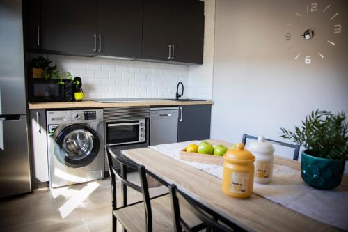 a kitchen with a table with apples on it at Playa del Silencio 1 in Castañeras