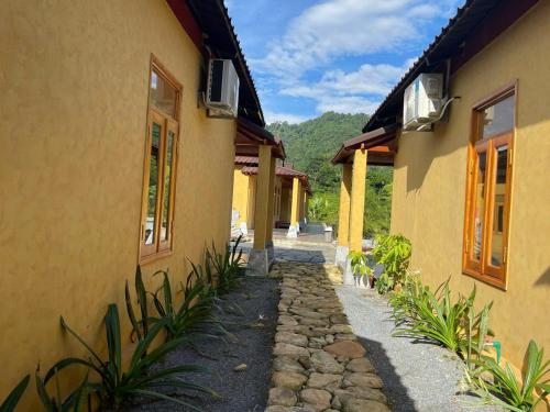 a stone walkway next to a building at Sky Bay Lodge in Ha Giang