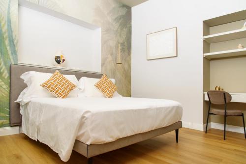 Postel nebo postele na pokoji v ubytování Vesuvius Palace Aparthotel