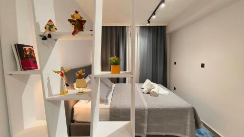 Postel nebo postele na pokoji v ubytování Dk Luxury Studio Xanthi