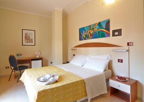 En eller flere senge i et værelse på Residence Parco del Sole