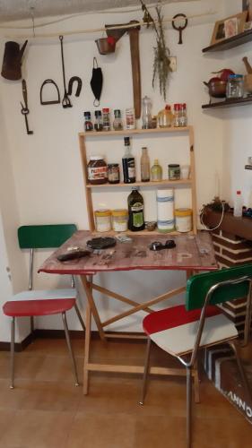 a table in a room with two chairs at Holiday Rome Hub Brigands' Fortress in Rocca Canterano in Canterano