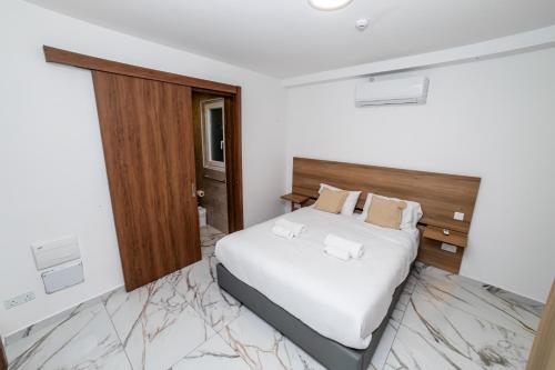 Postel nebo postele na pokoji v ubytování Modern Cosy Fully Equipped Apartment